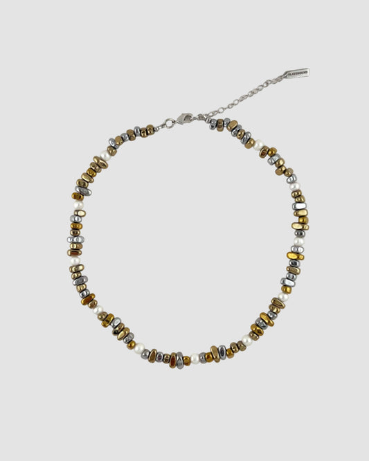 Beaded necklace on a light gray background