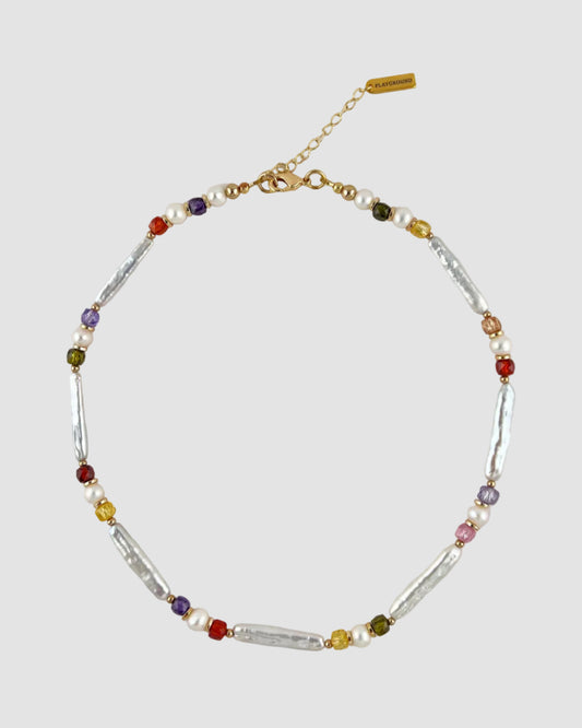 Multicolored beaded necklace on a light gray background