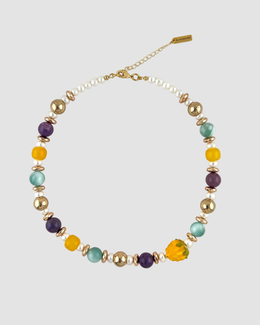 Necklace with multicolored beads on a white background