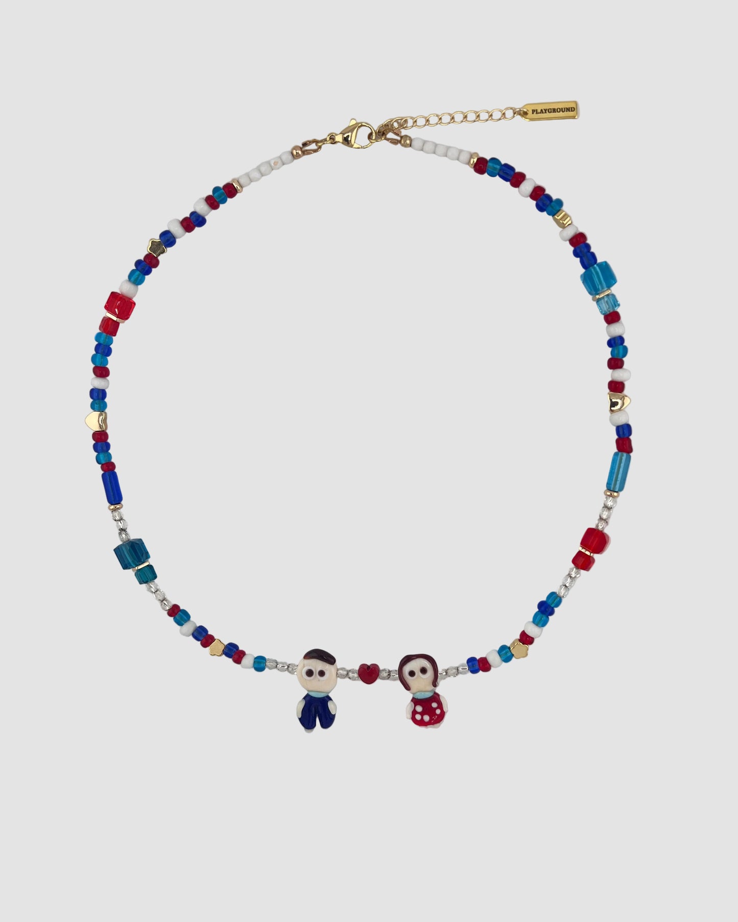 Necklace with colorful beads and small figures on a light gray background