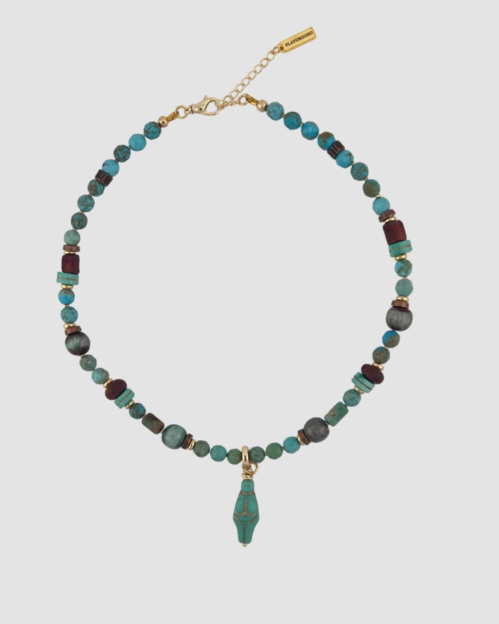 Necklace with blue and brown beads on a light gray background