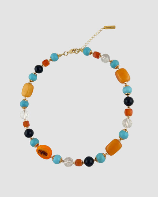 Necklace with multicolored beads on a white background