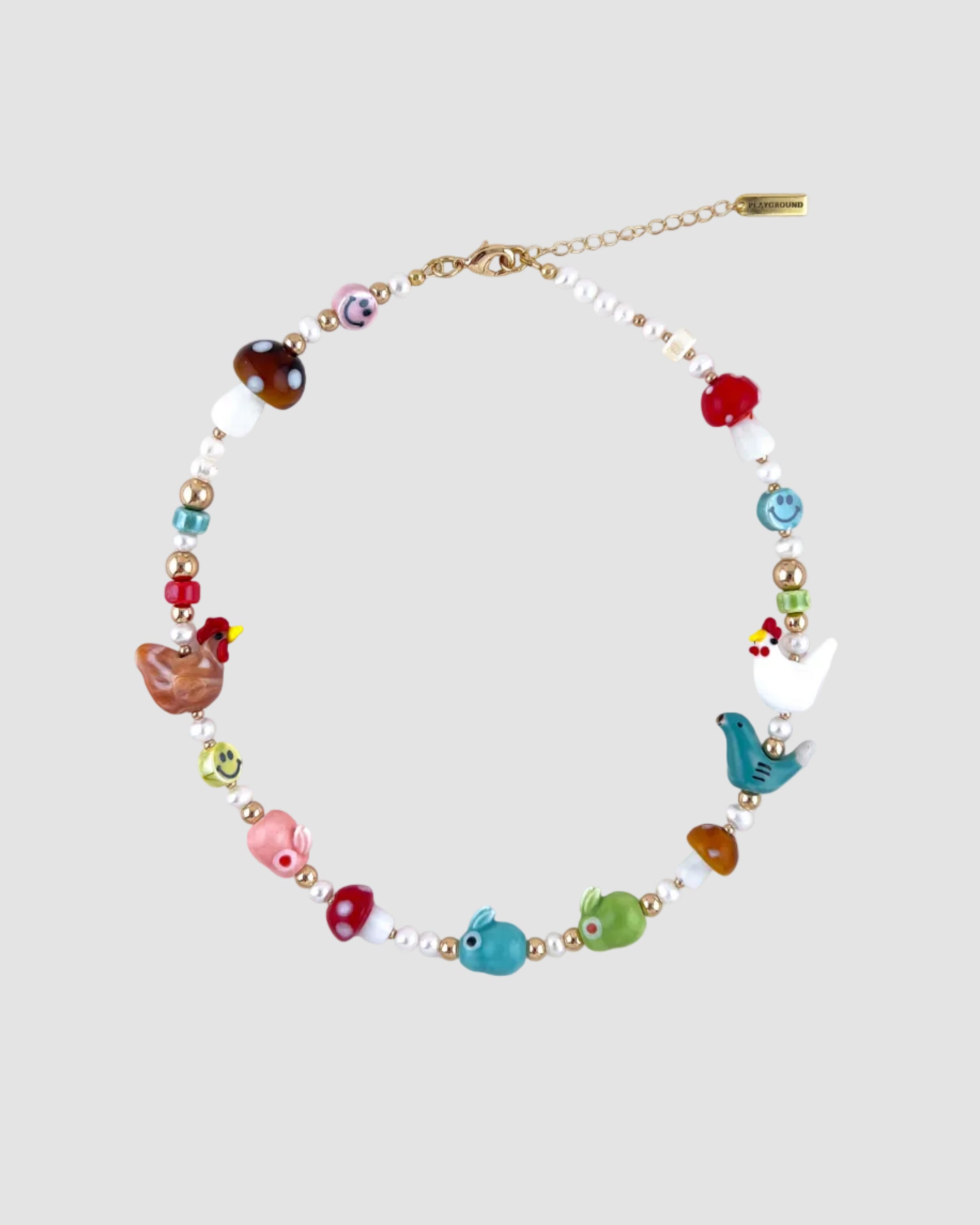 Necklace with colorful beads and charms on a white background