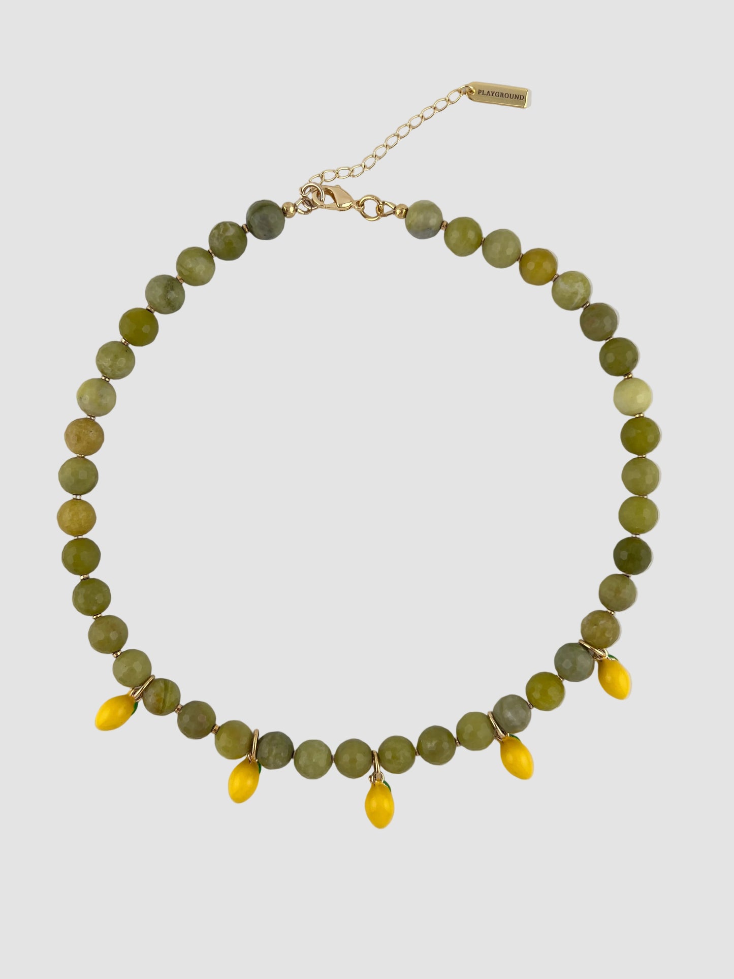 Necklace with green and yellow beaded chain on a white background