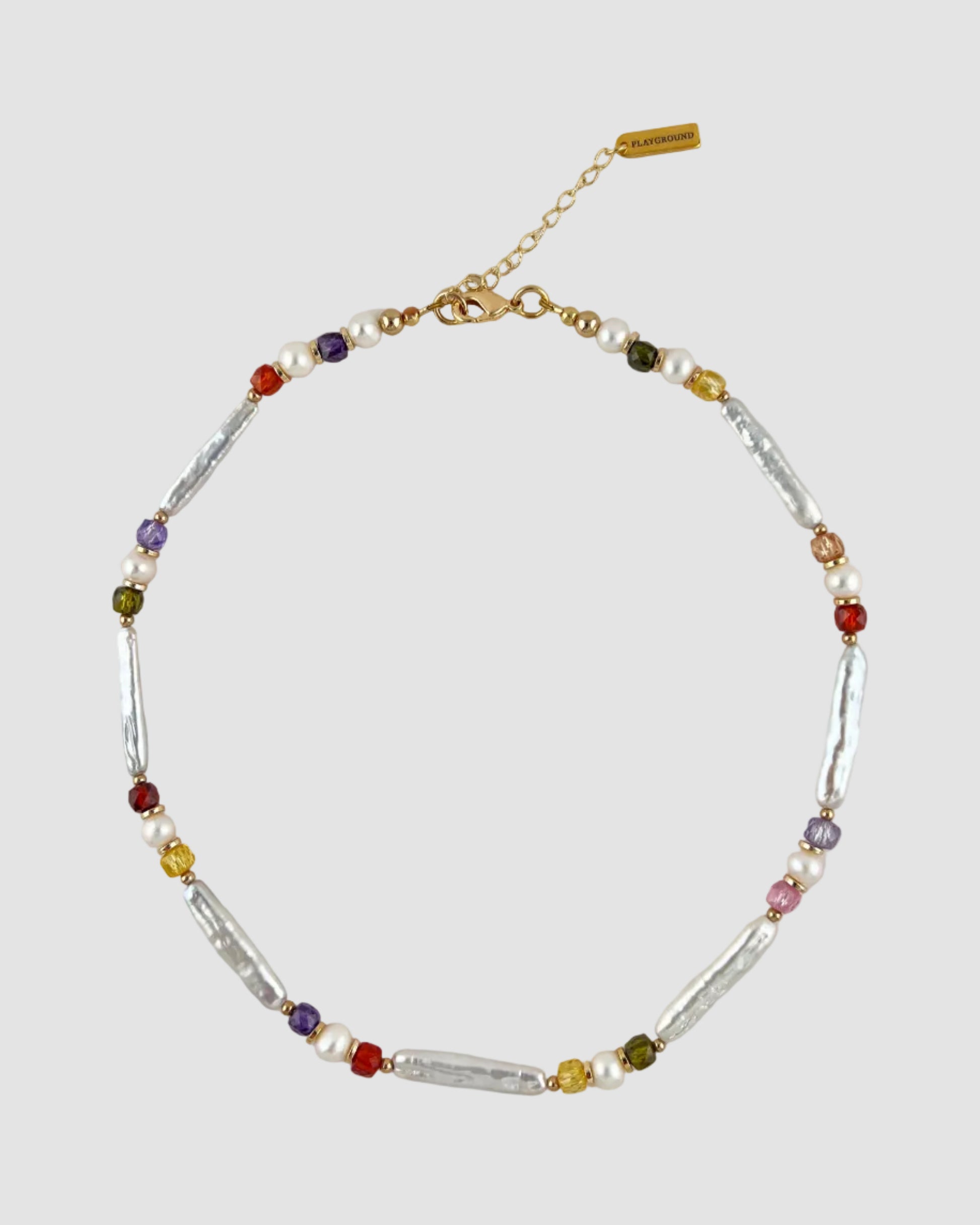 Multicolored beaded necklace on a light gray background
