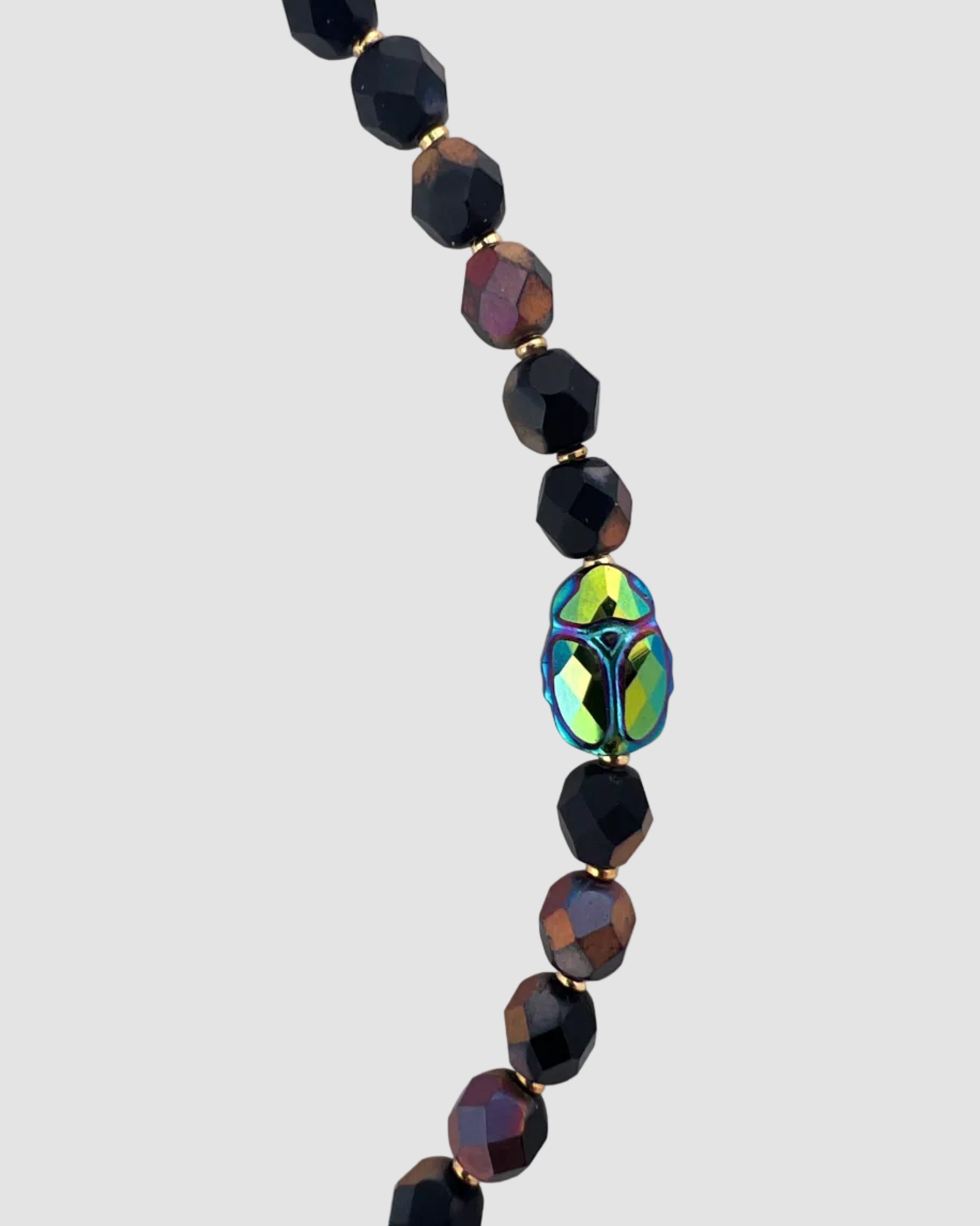 Necklace with black and multicolored beads on a white background