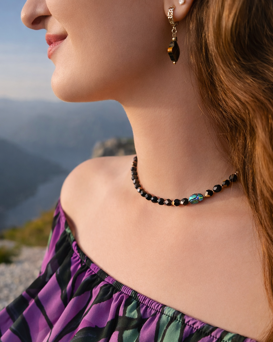 Woman wearing a necklace with a scenic background