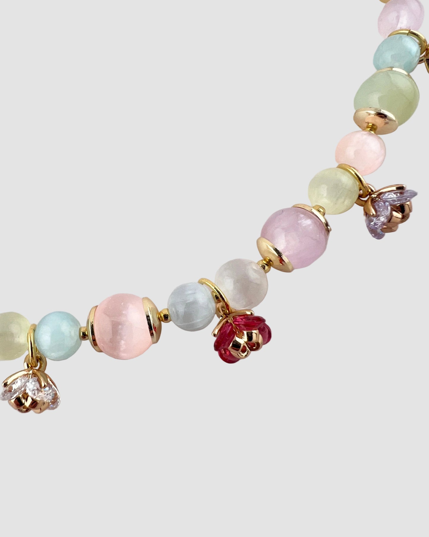 Colorful beaded necklace on a light gray background