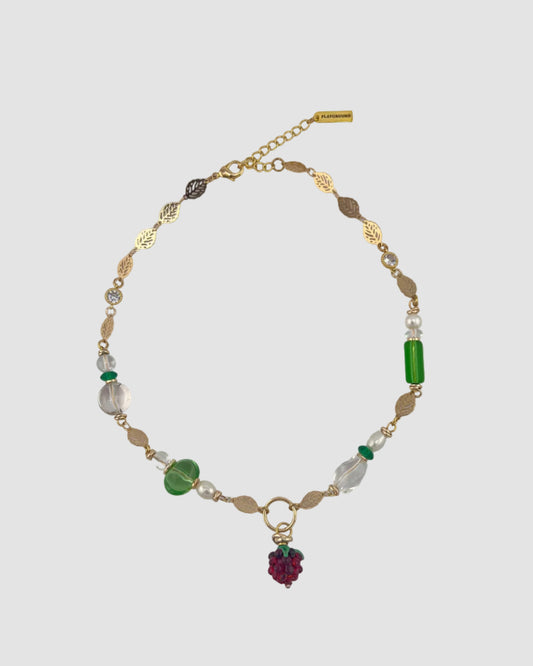 Necklace with beads on a gray background